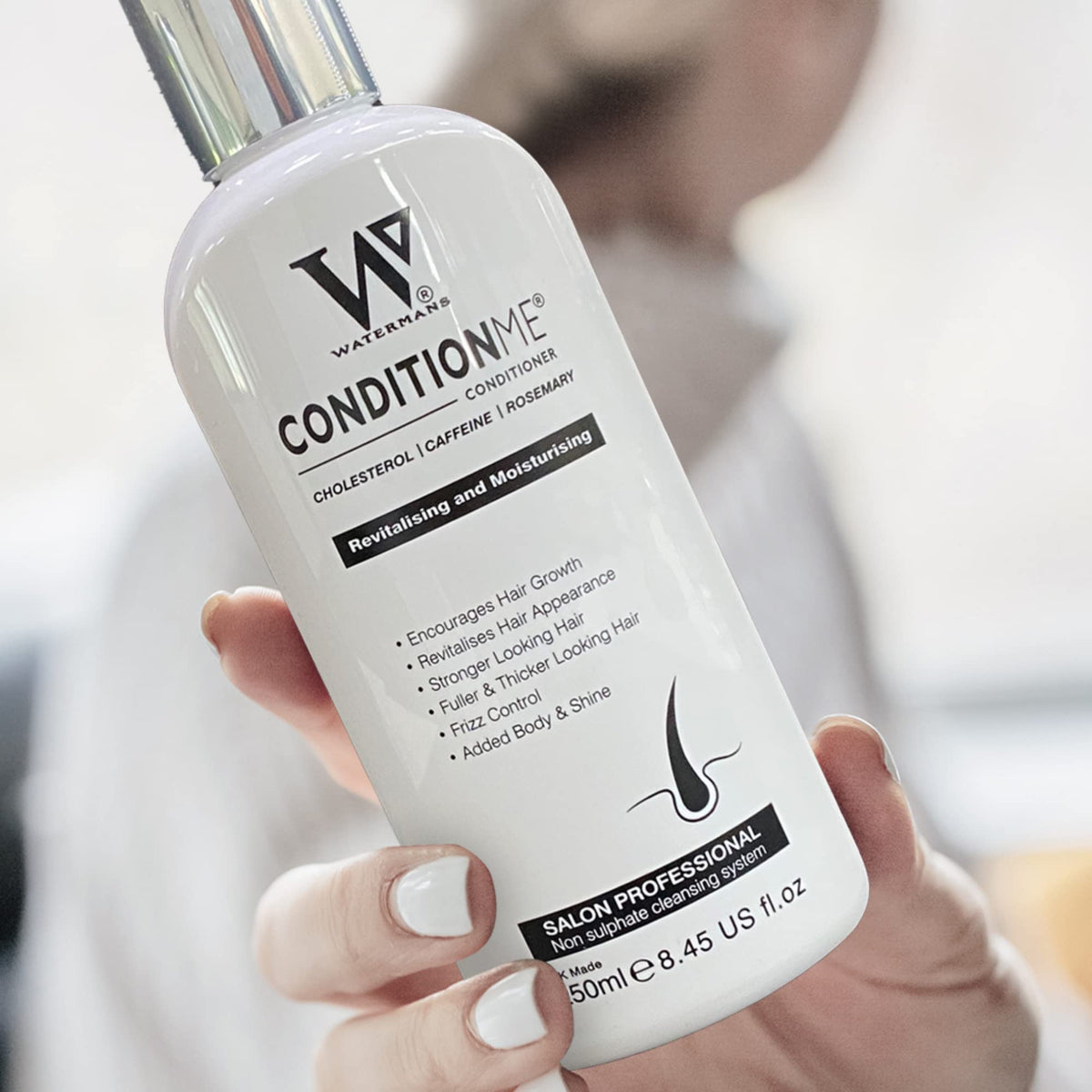 Watermans conditioner repairing damaged hair, restoring strength and resilience.