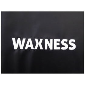 Waxness polyurethane pad on a salon table for easy cleaning between clients.