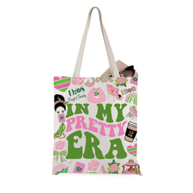 WCGXKO Sorority Tote front view in Pretty Era pink and green for stylish daily carry.