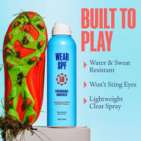 WearSPF athlete on field using sunscreen spray