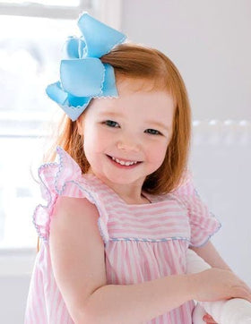 Wee Ones handmade bow in white and blue adds timeless charm.