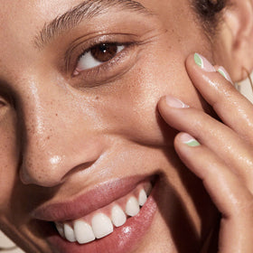 Well People Bio Booster Oil Drops applied to skin to boost moisture.
