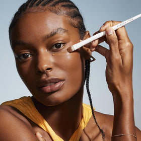 Well People Bio Correct concealer texture shown as creamy and hydrating.