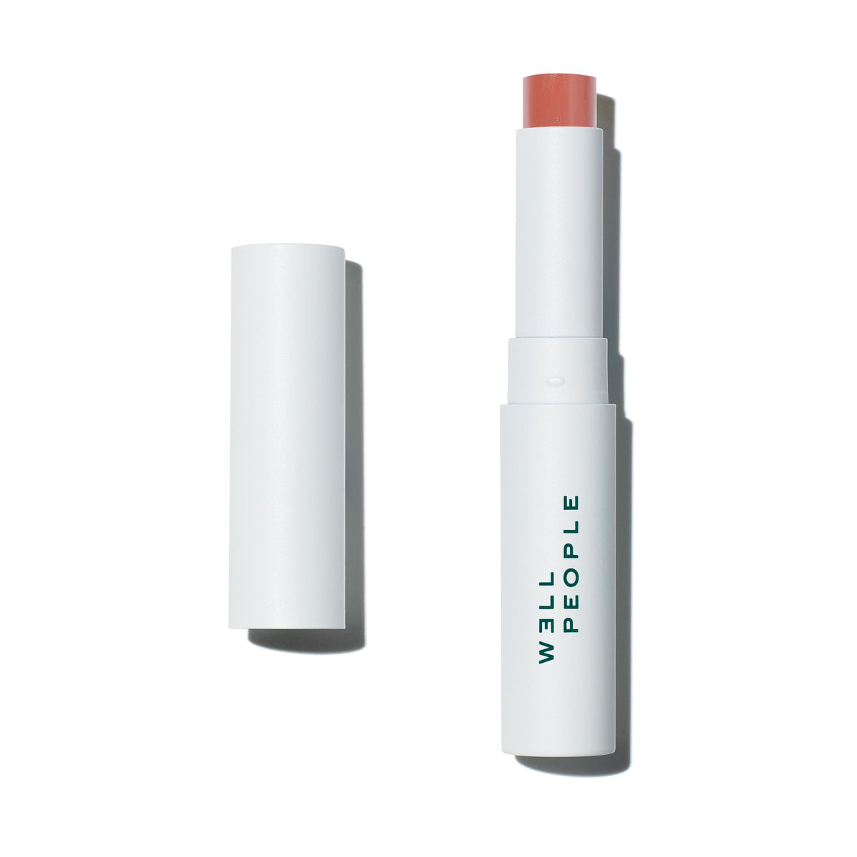 Well People Lip Butter SPF 15 Peach tube shown for hydration and sun protection