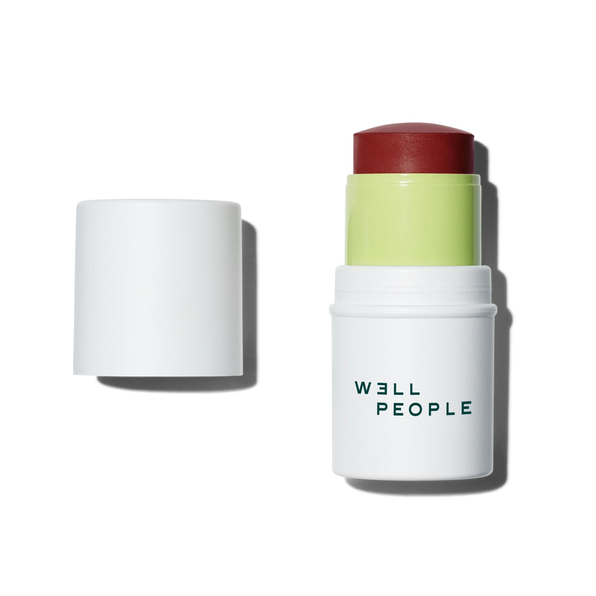 Well People Supernatural Stick blush swatch on cheek for natural flush.