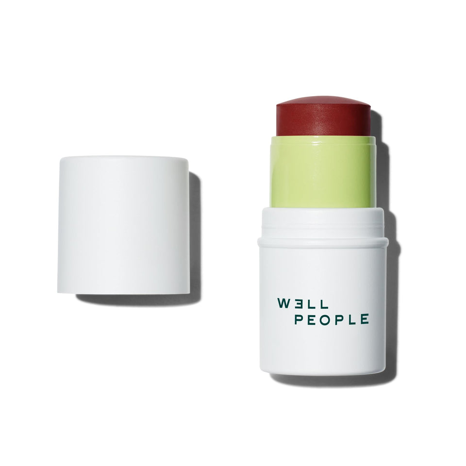 Well People Supernatural Stick blush swatch on cheek for natural flush.
