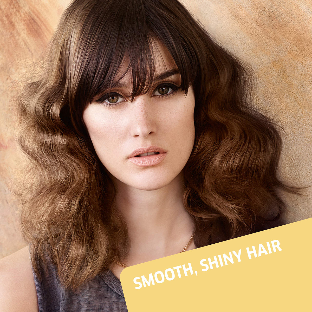 Wella EIMI Just Brilliant styling-dryer scene suggests quick sleek results.
