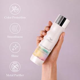 Hands apply ColorMotion+ shampoo for daily cleansing