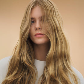 Wella Professionals ULTIMATE SMOOTH jasmine and vanilla fragrance notes on the bottle.