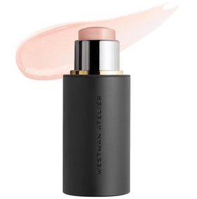 Westman Atelier Lit Up Highlighter Stick Nectar enhances cheekbone glow for radiant definition.