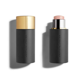 Westman Atelier Lit Up Highlighter Stick Nectar adds lip glow and hydrated shine.