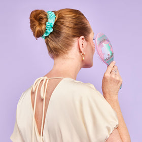 Wet Brush detangling glide on wet hair reduces snagging