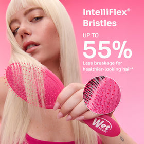 Wet Brush Original Detangler pink gliding through dry hair