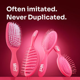 Close-up showing tangle-free detangling with IntelliFlex bristles