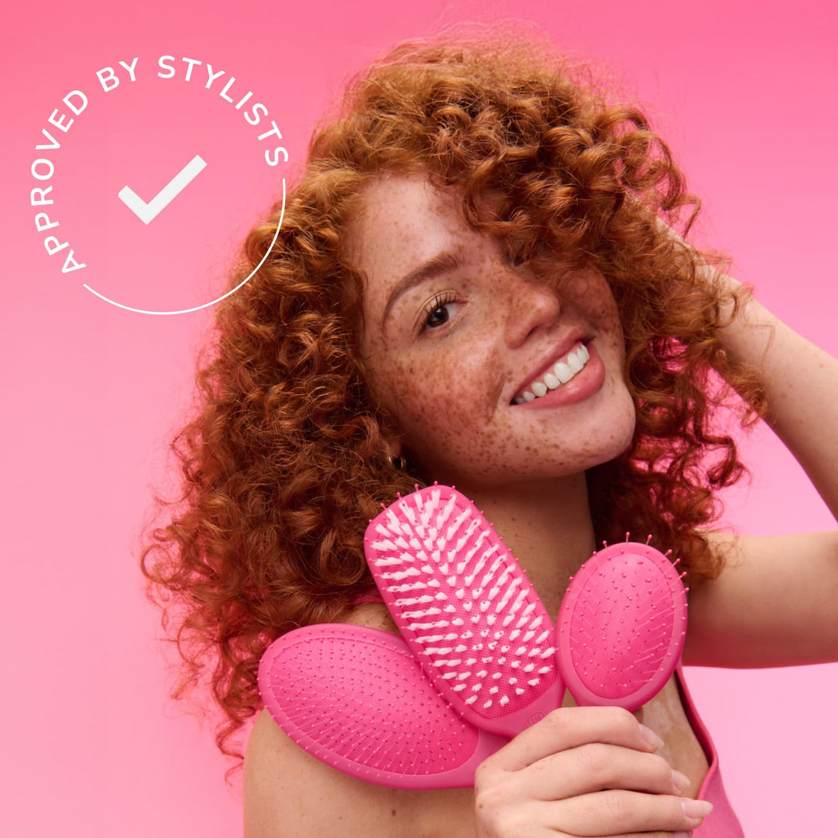 Wet Brush Desert Afterglow purple detangler helps prevent snags during brushing.