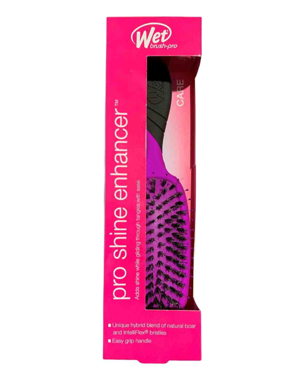 Wet Brush Pro Detangler Shine Enhancer in purple gliding through hair for gentle detangling