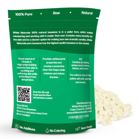 White Naturals cosmetic-grade beeswax pellets close-up showing smooth texture.