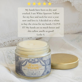 Applying White Sparrow Farmacy tallow balm on the skin to illustrate smooth coverage.