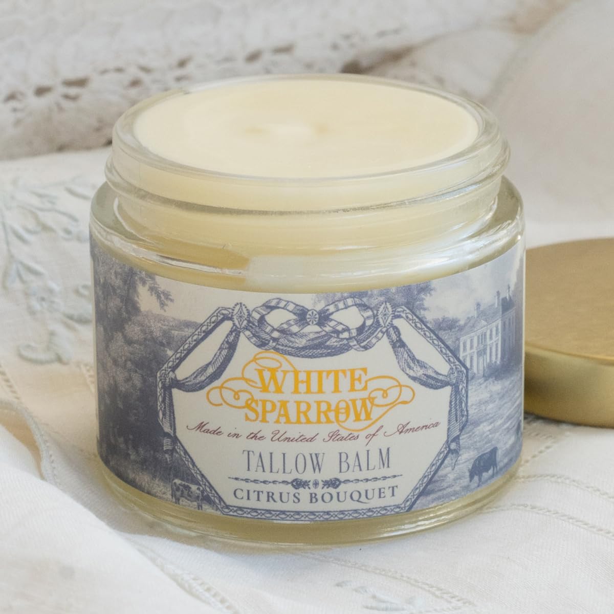 White Sparrow Farmacy tallow balm Citrus Bouquet jar with a refreshing citrus scent for skin nourishment.