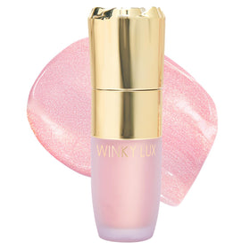 Winky Lux Cheeky Rose highlighter bottle glows with dewy pink opal shine.