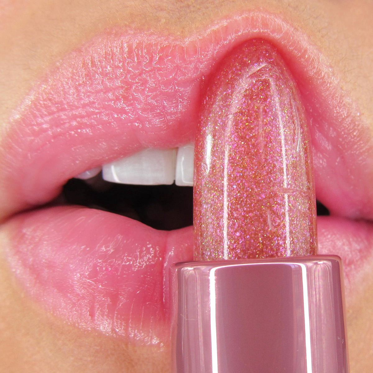 Winky Lux Pink Opal Glimmer Balm Raspberry Vanilla fragrance adds sweetness.