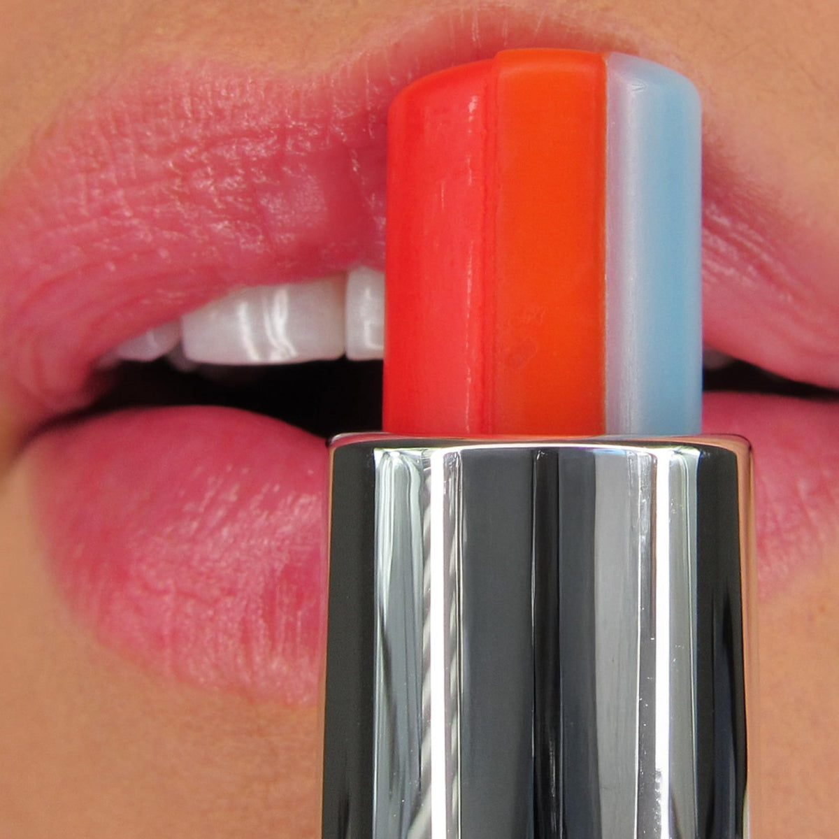 Winky Lux Rainbow Lip Balm being applied for semi-shine, comfortable wear