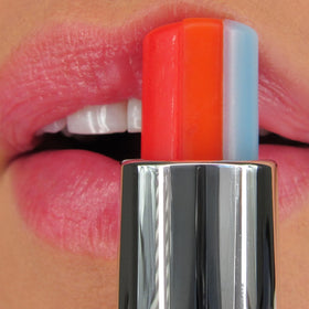 Winky Lux Rainbow Lip Balm being applied for semi-shine, comfortable wear