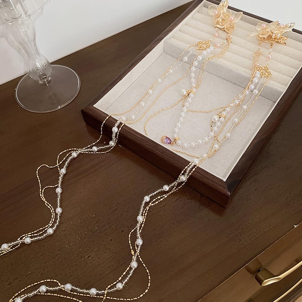 Wiwpar gold-tone butterfly hair ornament adds refined flair.