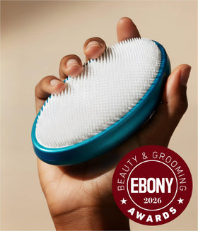 WIZKER Premium Ingrown Hair Brush firm bristles on tough areas for exfoliation.