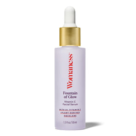 Womaness Fountain of Glow bottle close-up highlighting brightening formula.
