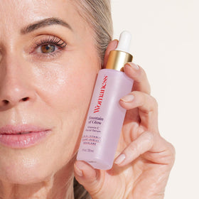 Womaness Fountain of Glow serum texture sinking in for dewy glow.