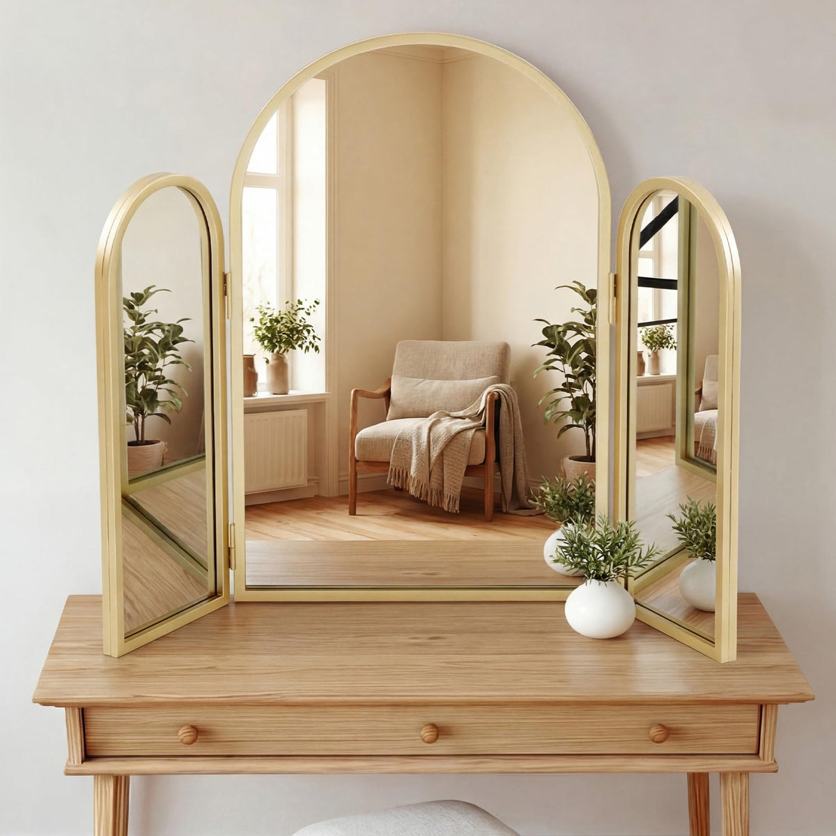 Wonderjune tri-fold vanity mirror with gold frame for precise makeup reflections.
