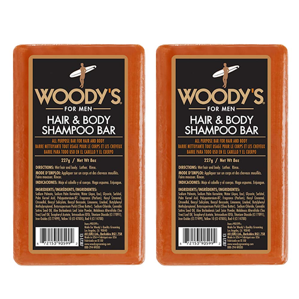 Woody's Hair & Body Bar for Men in hand, compact travel-friendly cleansing.