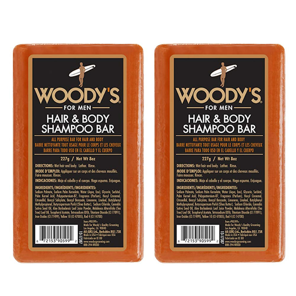 Woody's Hair & Body Bar for Men in hand, compact travel-friendly cleansing.