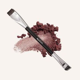 Woosh The Arc Brush curved tip for precise winged liner application.