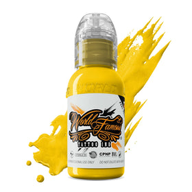 World Famous Tattoo Ink Canary Yellow bottle pour showing vibrant, high-opacity coverage
