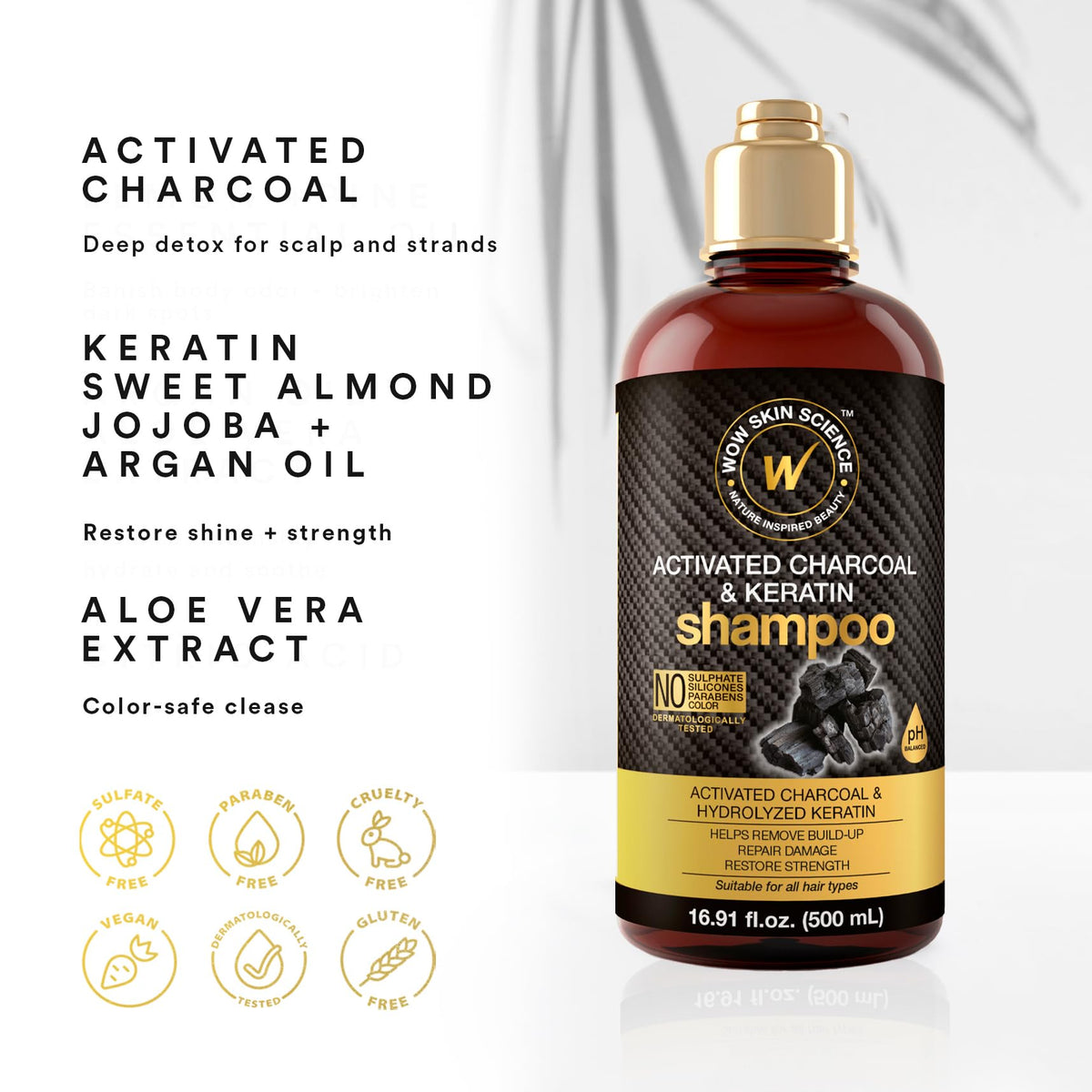 WOW Skin Science Activated Charcoal Keratin Shampoo bottle during scalp massage for even distribution.