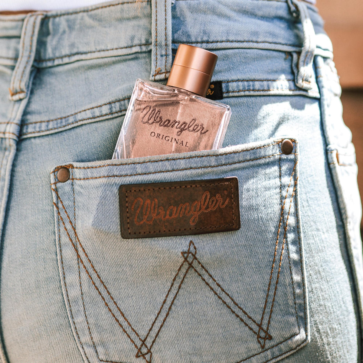 Wrangler Original scent profile graphic illustrates top, middle, and base notes.
