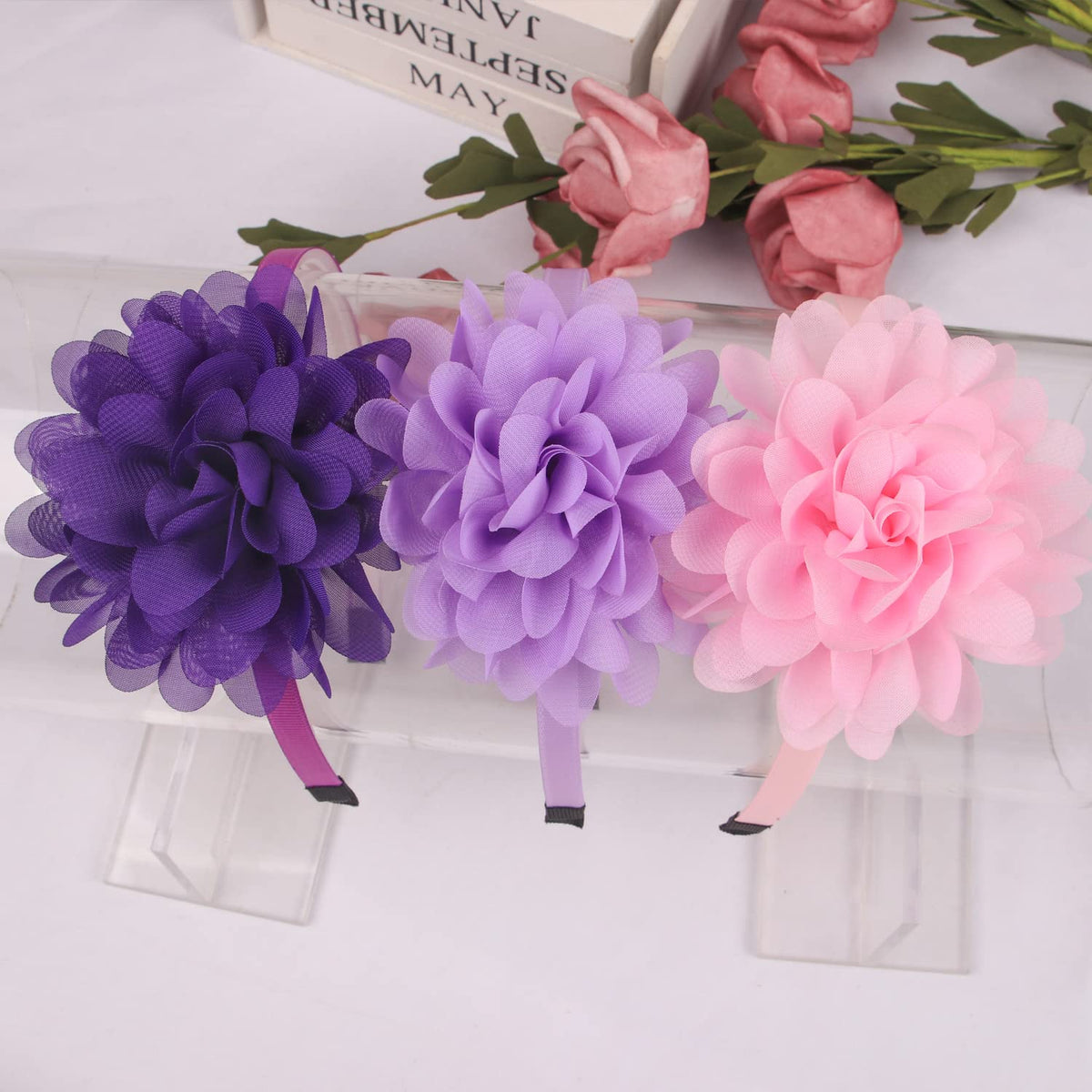 XIMA headbands for baby girls brighten hairstyles with a delicate flower.