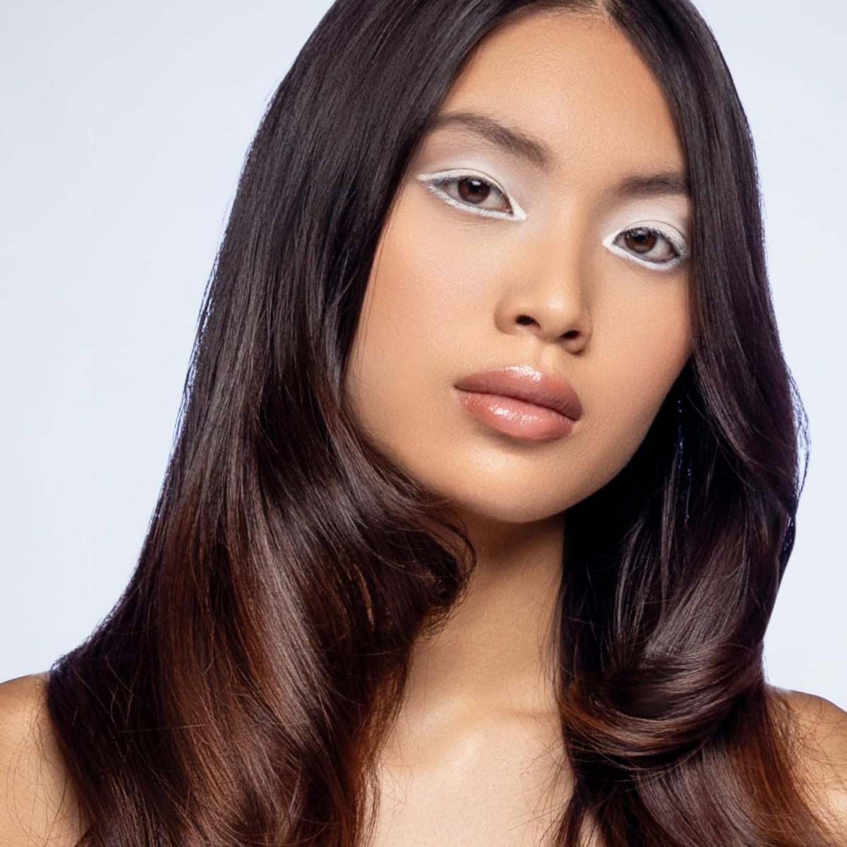 XMONDO Hair Forcefield Heat Shield bottle dispense action for quick styling.