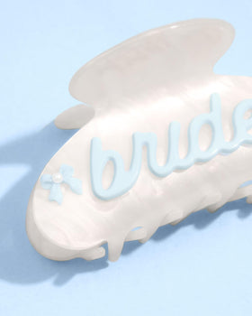 xo Fetti Bride Claw Clip highlights cursive bride text with pearl accents.