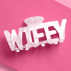 xo, Fetti Wifey claw hair clip in white marble acrylic for bridal photos.
