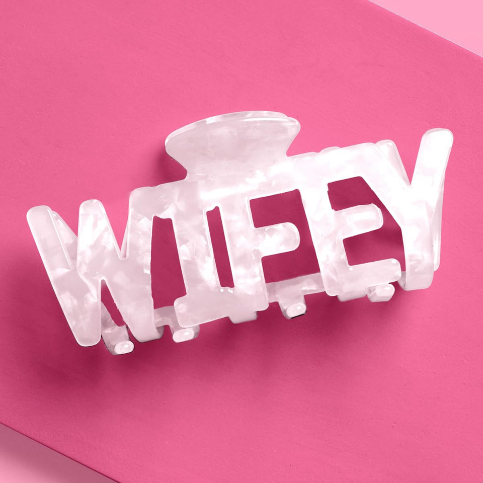 xo, Fetti Wifey claw hair clip in white marble acrylic for bridal photos.