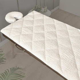 XOLLOZ double-sided massage pad with plush fleece for cozy warmth during treatments.
