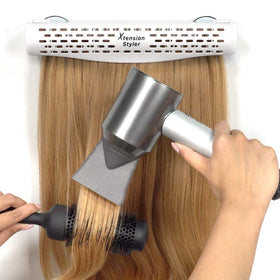 Xtension Styler displaying clip-in and tape-in extensions on the hanger