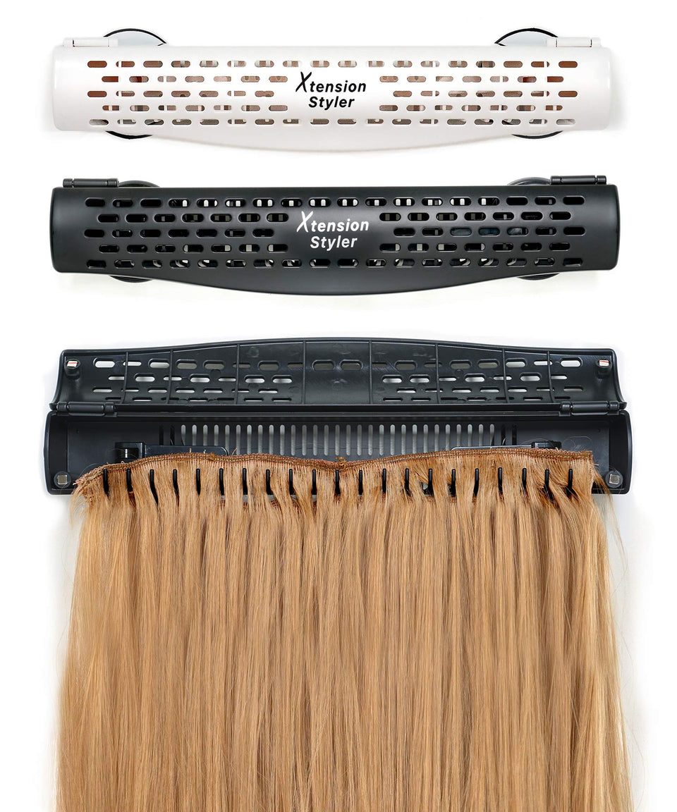Xtension Styler hair extension holder mounted on a mirror for hands-free styling