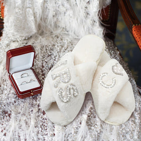 Xtinmee crown patch with pearl rhinestones on the bride slippers.