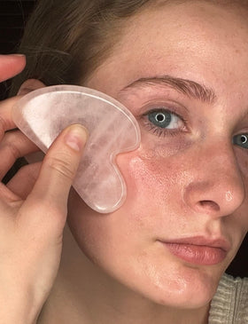 XYZ Skin Gua Sha Glide label closeup highlights vegan ingredients and clean formula