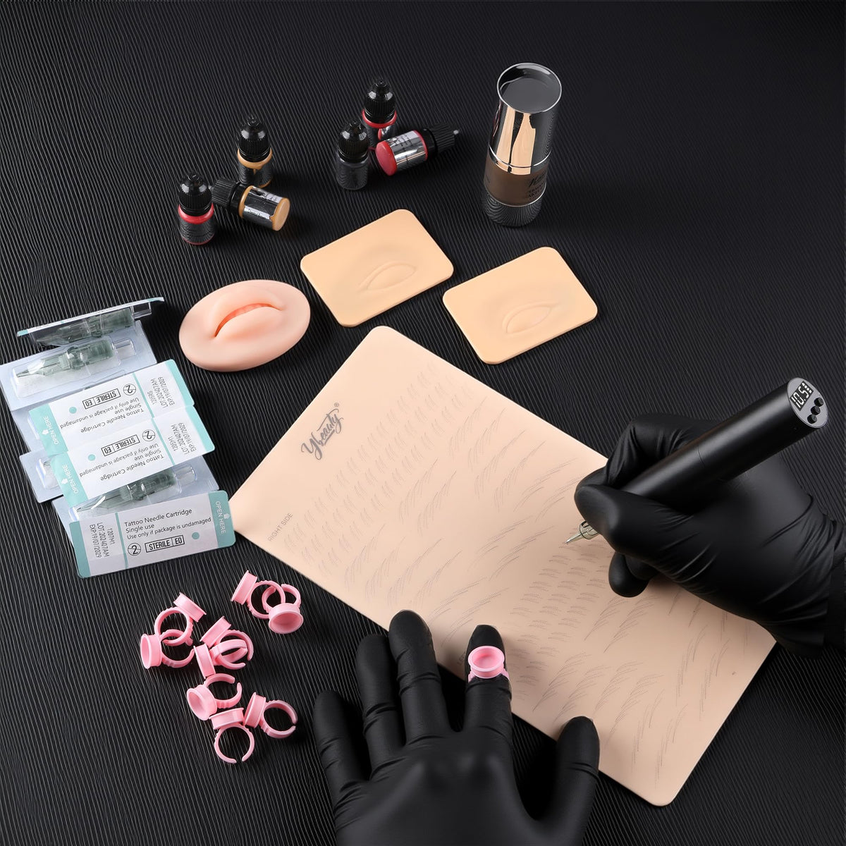 Ybeauty ink ring cup for neat pigment management during sessions.