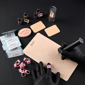 Ybeauty ink ring cup for neat pigment management during sessions.